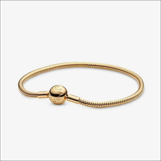 Armband med Snake Bone Länk och Rund Lås Guld Pandora
