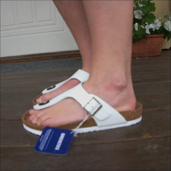 Birkenstock Gizeh White sandals with ergonomic cork sole, showcasing stylish T-strap design.