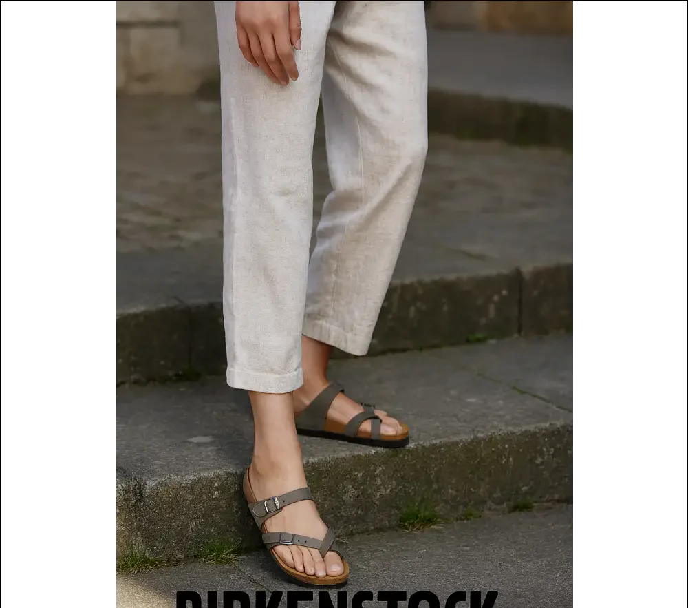Birkenstock Mayari sandals in stone Birko-Flor worn casually with linen pants on outdoor steps.