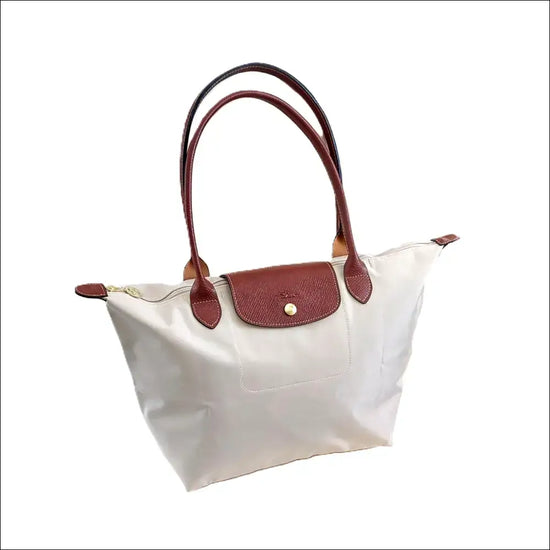 Longchamp Le Pliage L – Paper White Large Tote Bag with brown leather handles and zipper detail.
