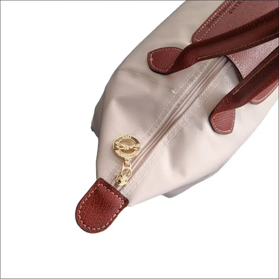 Longchamp Le Pliage L - Paper White Large Tote Bag zipper detail with brown handles and gold hardware